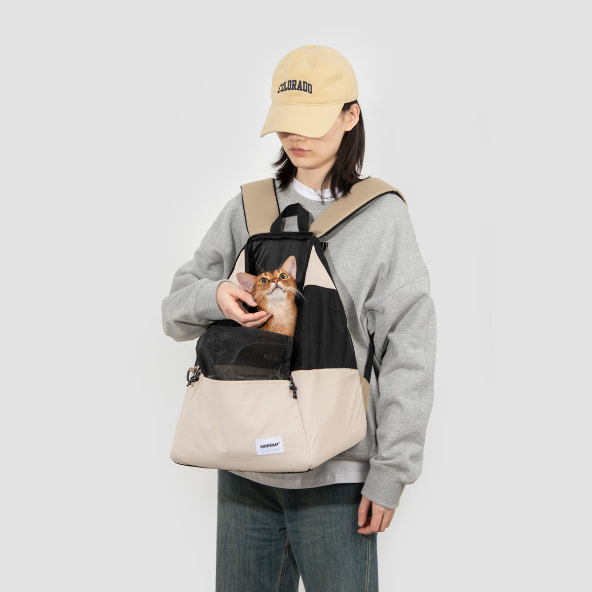 Lightweight pet carrier backpack used with a small pet during an everyday outing